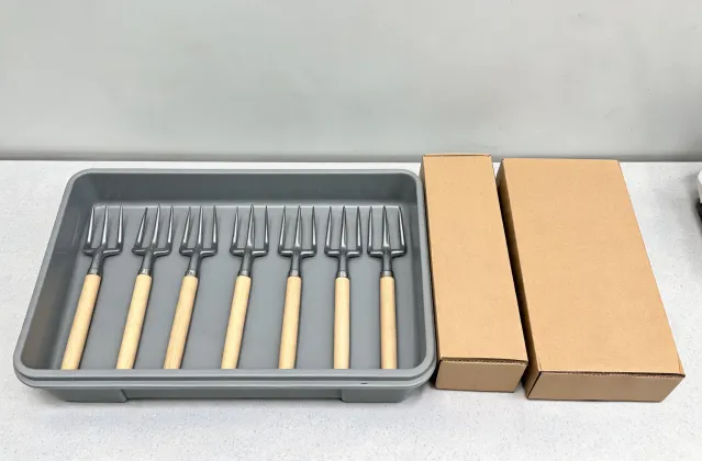 Garden hand tools arranged in a storage tray
